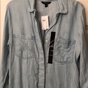 Long sleeve button down jean shirt.